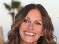 O cabelo levemente ondulado de Julia Roberts cria assimetria com o rosto longo Foto: Getty Images