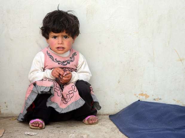 Menina que fugiu da Síria com os pais para a vila libanesa de Arsal Foto: AFP