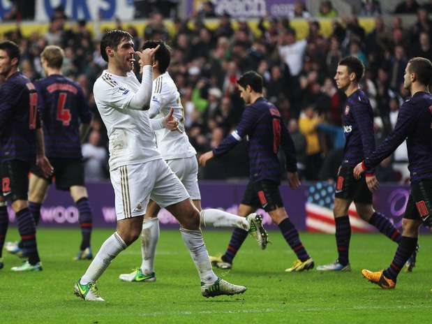 Danny Graham comemora gol de empate do Swansea contra o Arsenal, nos minutos finais do jogo Foto: Getty Images Danny Graham comemora gol de empate do Swansea contra o Arsenal, nos minutos finais do jogo Foto: Getty Images